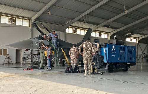 A military aircraft maintenance scenario inside a hangar