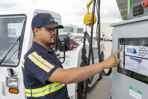 Operator using AmpCart control panel pushing a button